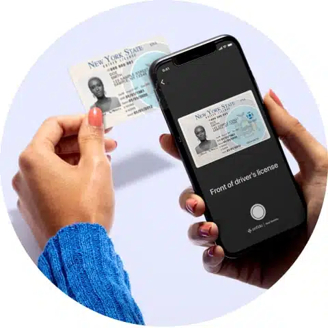User holding phone to scan drivers license